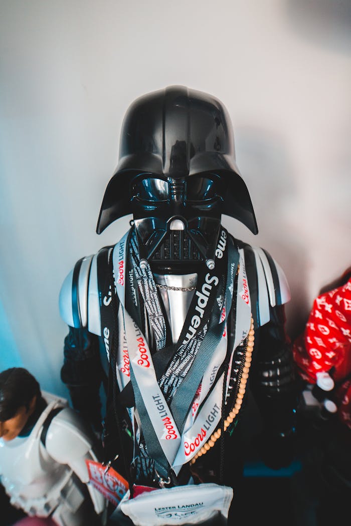 From above of villain character in helmet and stylish modern outfit placed on shelf at home